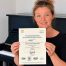 Emma celebrating her ABRSM Piano Performance Grade 3 Distinction