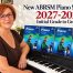 Anna Peszko at the piano with ABRSM Piano Exam Pieces books for the new 2027-2028 syllabus.