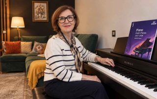 Anna Peszko at a Kawai digital piano with the ABRSM Grade 1 Piano Exam Pieces 2027–2028 book.