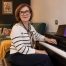 Anna Peszko at a Kawai digital piano with the ABRSM Grade 1 Piano Exam Pieces 2027–2028 book.
