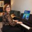 Anna Peszko at a Kawai digital piano with the ABRSM Grade 2 Piano Exam Pieces 2027–2028 book.