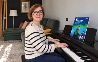 Anna Peszko at a Kawai digital piano with the ABRSM Grade 6 Piano Exam Pieces 2027–2028 book.