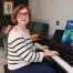 Anna Peszko at a Kawai digital piano with the ABRSM Grade 6 Piano Exam Pieces 2027–2028 book.