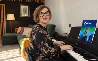 Anna Peszko at a Kawai digital piano with the ABRSM Grade 7 Piano Exam Pieces 2027–2028 book.
