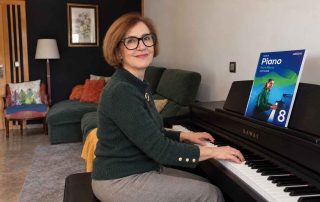 Anna Peszko at a Kawai digital piano with the ABRSM Grade 8 Piano Exam Pieces 2027–2028 book.